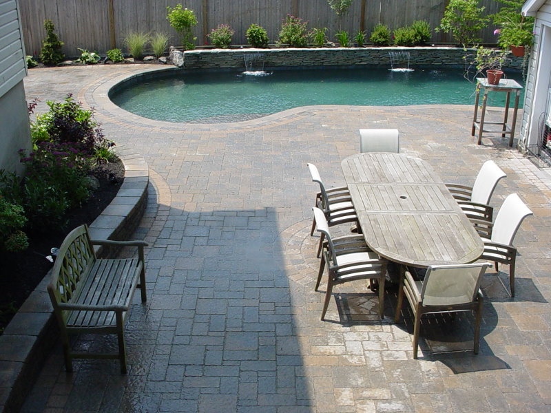 pool patio with stone sheer descent